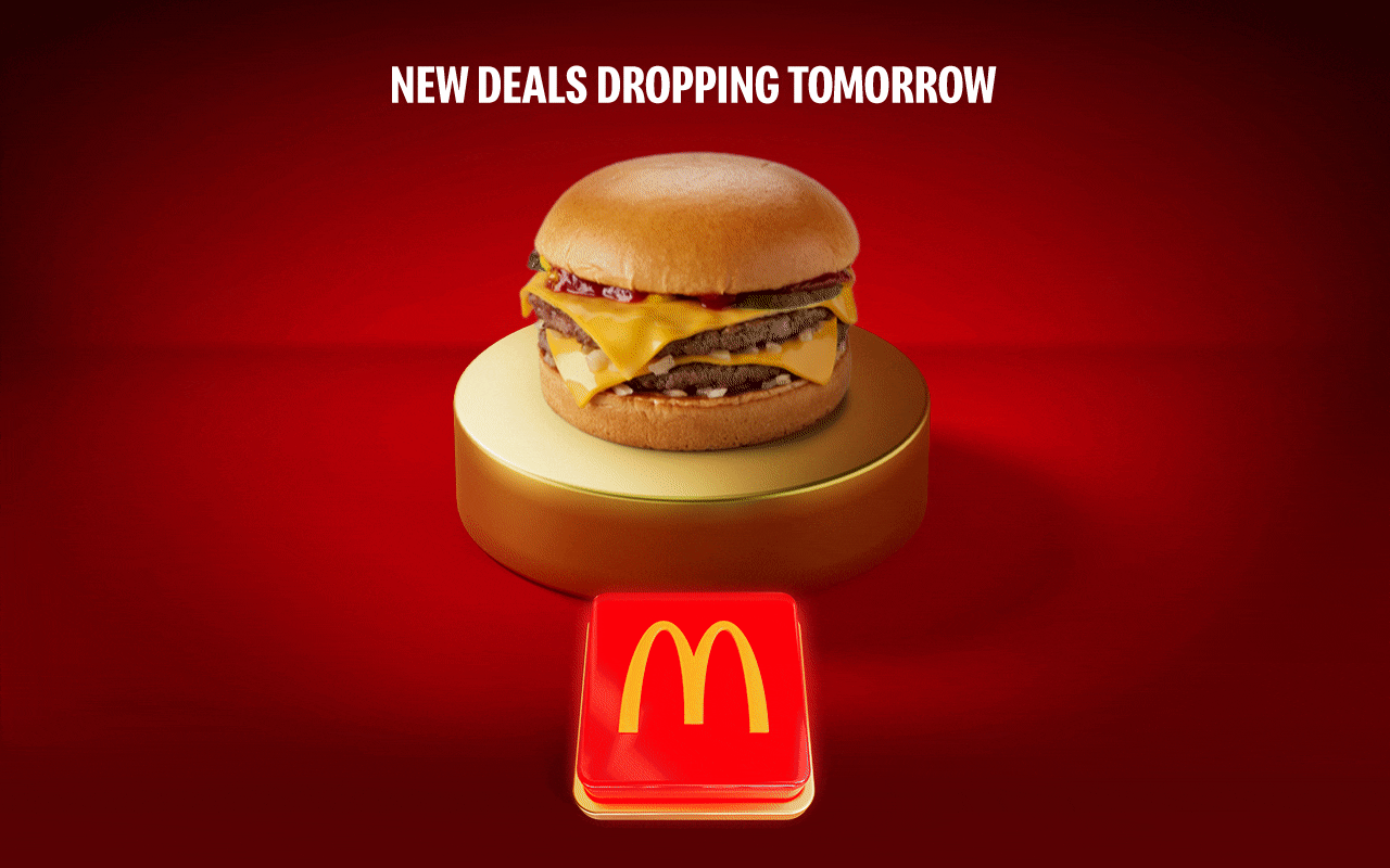 Various McDonald's favourites flash up on the gold plinth, one after the other. Text reads NEW DEALS DROPPING TOMORROW
