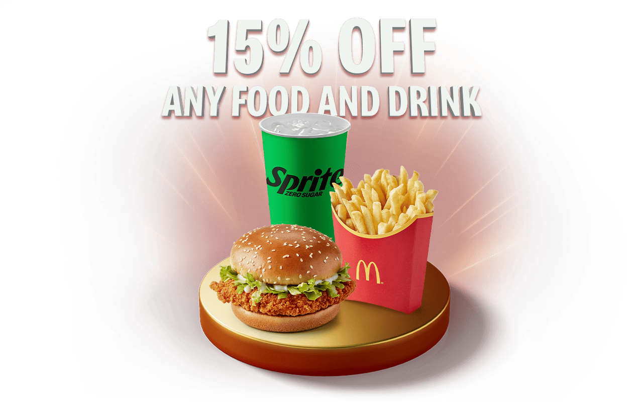 A delicious McChicken Sandwich®, fries and soft drink sit on a gold plinth. Text reads 15% OFF ANY FOOD AND DRINK