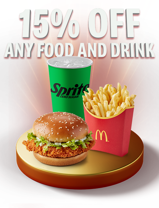 A delicious McChicken Sandwich®, fries and soft drink sit on a gold plinth. Text reads 15% OFF ANY FOOD AND DRINK