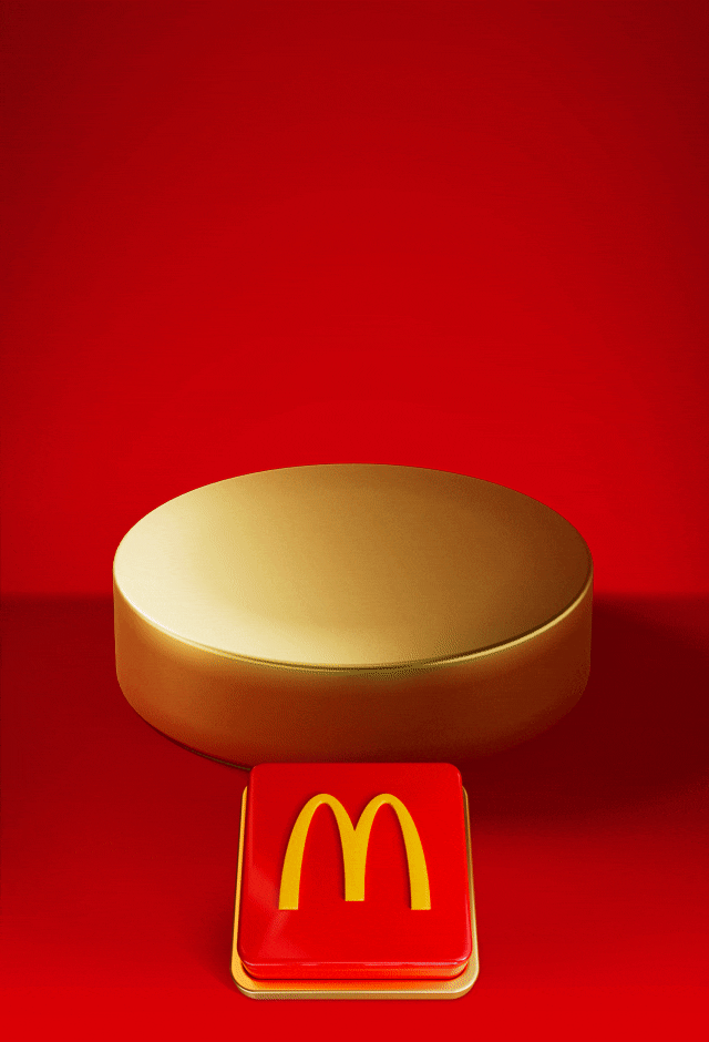 An empty gold plinth sits on a red background with a big red button beneath it. Text reads PUSH THE BUTTON TO REVEAL TOMORROW'S OFFER