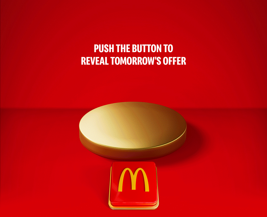 An appetising McDonald's meal sits on a gold plinth. Celebratory gold icons explode out. Text reads SAVE £15% WHEN YOU SPEND £8 ON FOOD OR DRINK