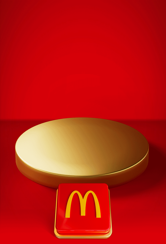 An empty gold plinth sits on a red background with a big red button beneath it. Text reads PUSH THE BUTTON TO REVEAL TOMORROW'S OFFER