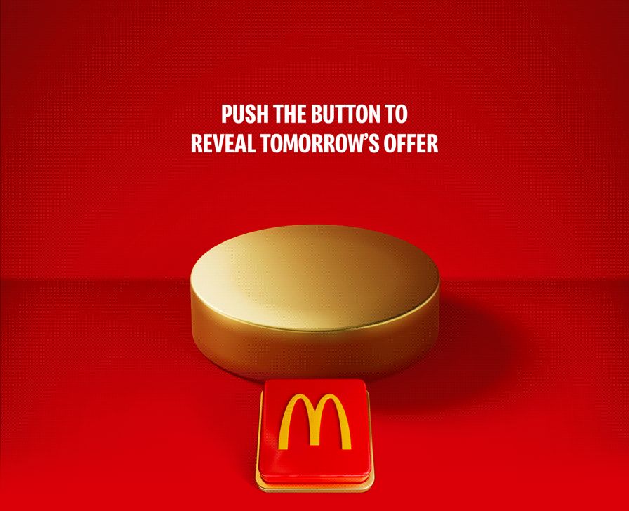 A tasty-looking Double Cheeseburger drops onto the plinth. Celebratory gold icons explode out. Big white text reads £1.29 Double Cheeseburger