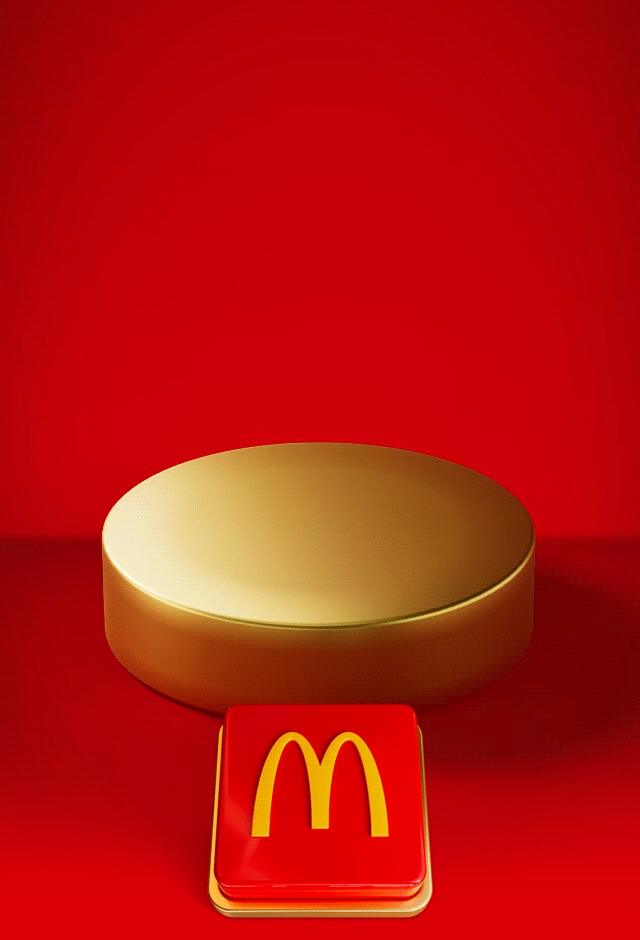 An empty gold plinth sits on a red background with a big red button beneath it. Text reads PUSH THE BUTTON TO REVEAL TOMORROW'S DEAL