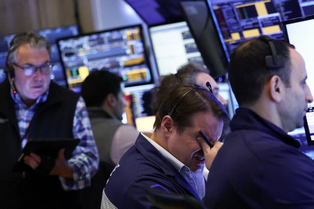 Traders react to the news of the markets plunging on Wall Street