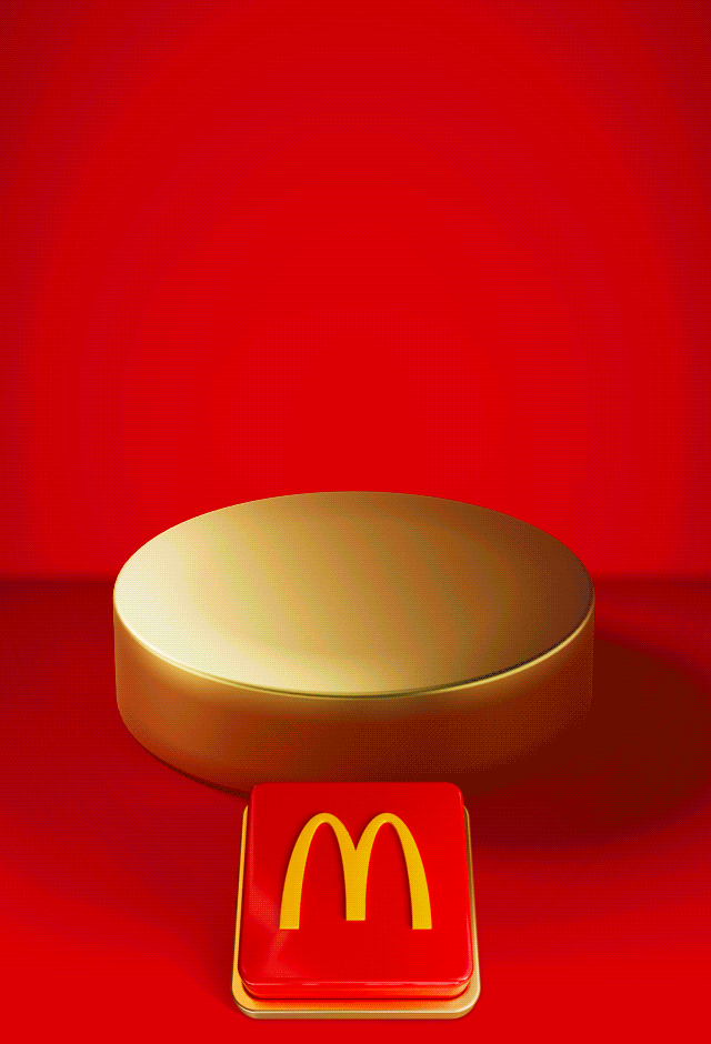 An appetising McDonald's meal sits on a gold plinth. Celebratory gold icons explode out. Text reads SAVE 15% WHEN YOU SPEND £15 ON FOOD OR DRINK