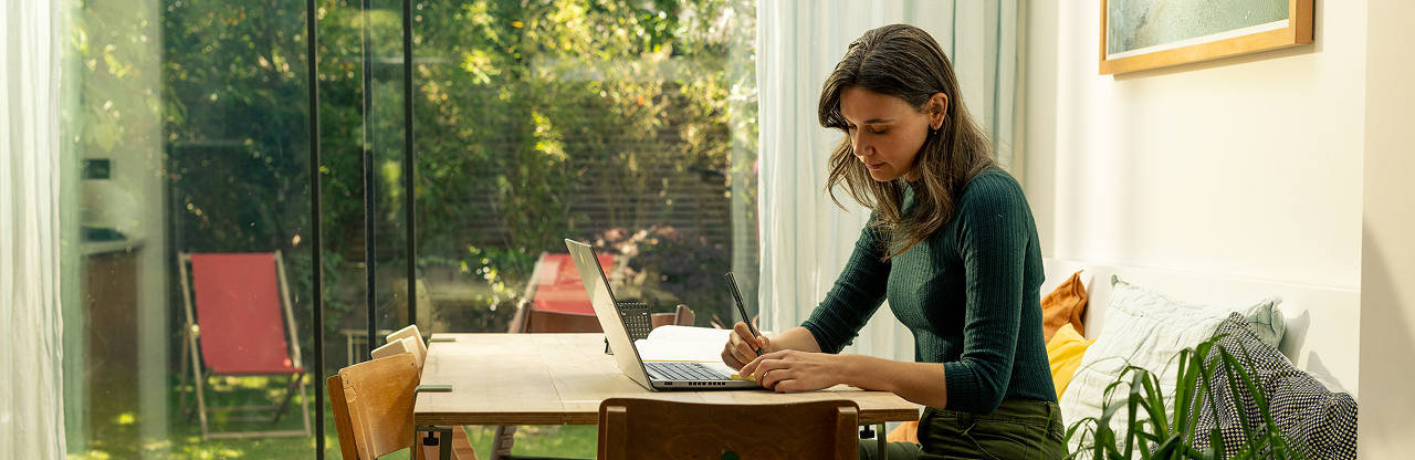 woman on her laptop in her home