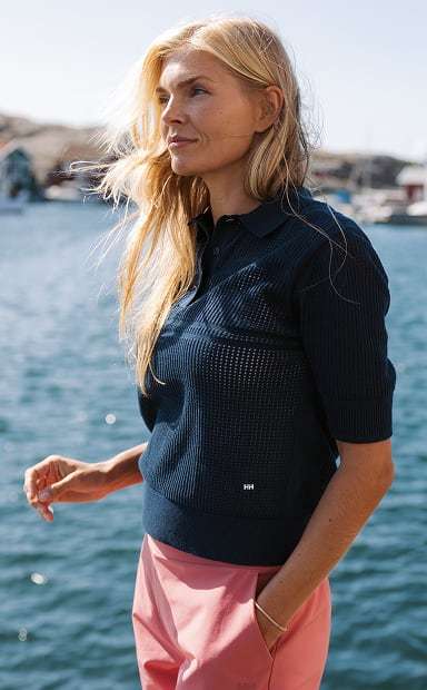 Woman wearing Helly Hansen gear by the ocean