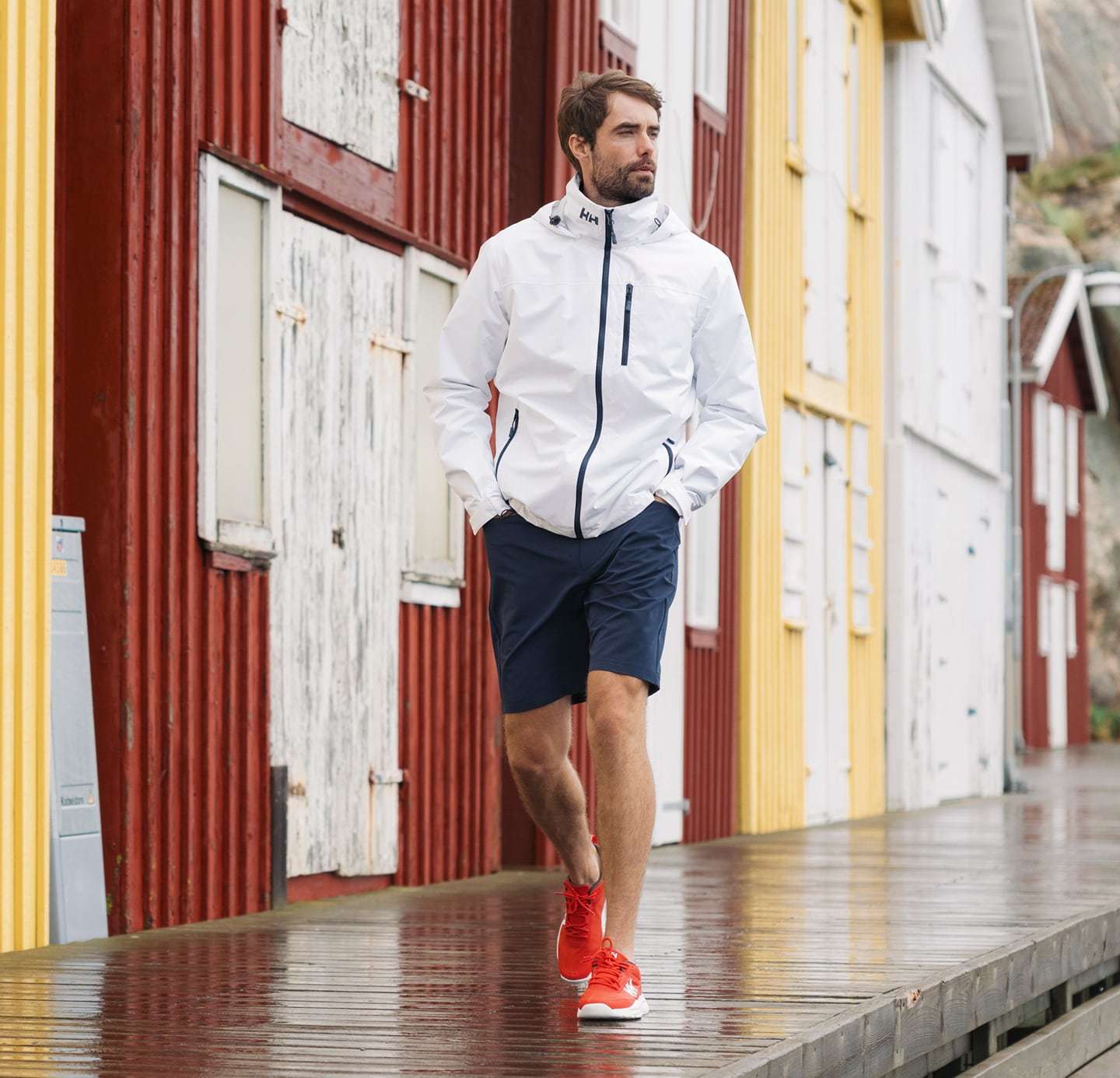 Man wearing Fjord Quick-Dry Short Sleeve Shirt 2.0 by the ocean