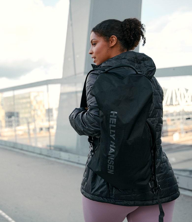 Woman wearing Helly Hansen backpack in the city