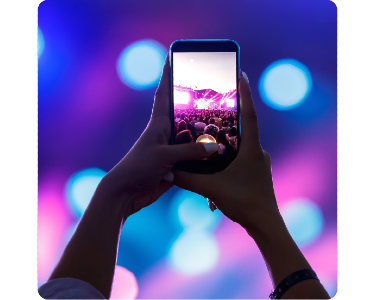 A phone taking a photo in a crowd