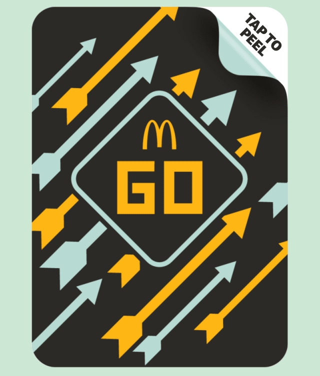 Mcdonald's Monopoly game peel. Text reads TAP TO PEEL