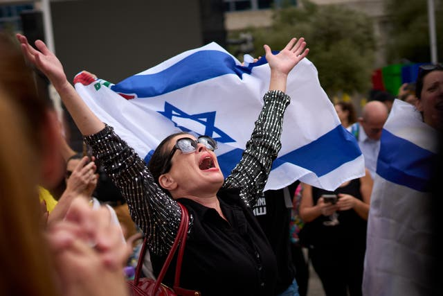 Demonstrators celebrate news of a ceasefire in Gaza