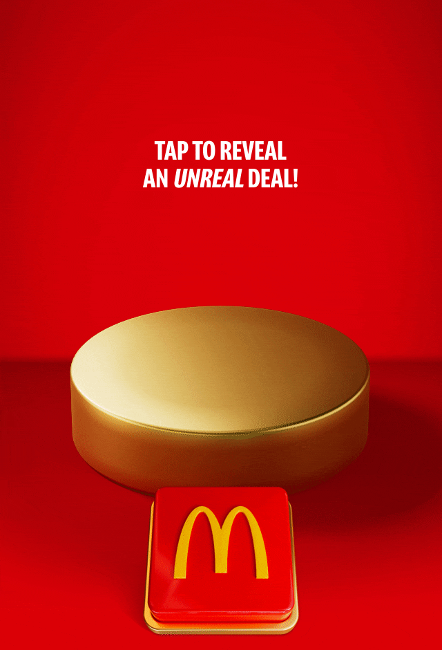 An empty gold plinth sits on a red background with a big red button beneath it. Text reads TAP TO REVEAL AN UNREAL DEAL