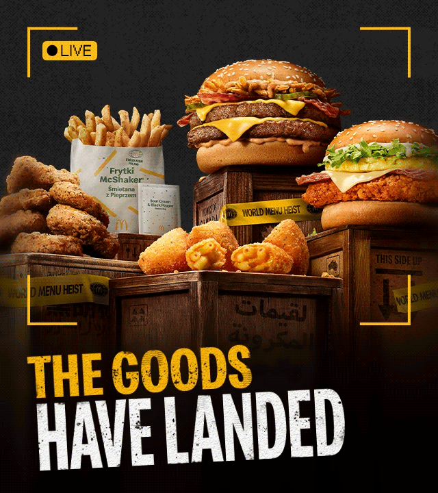 The heisted world stash displayed on top of wooden crates. Bold text reads 'The goods have landed'.