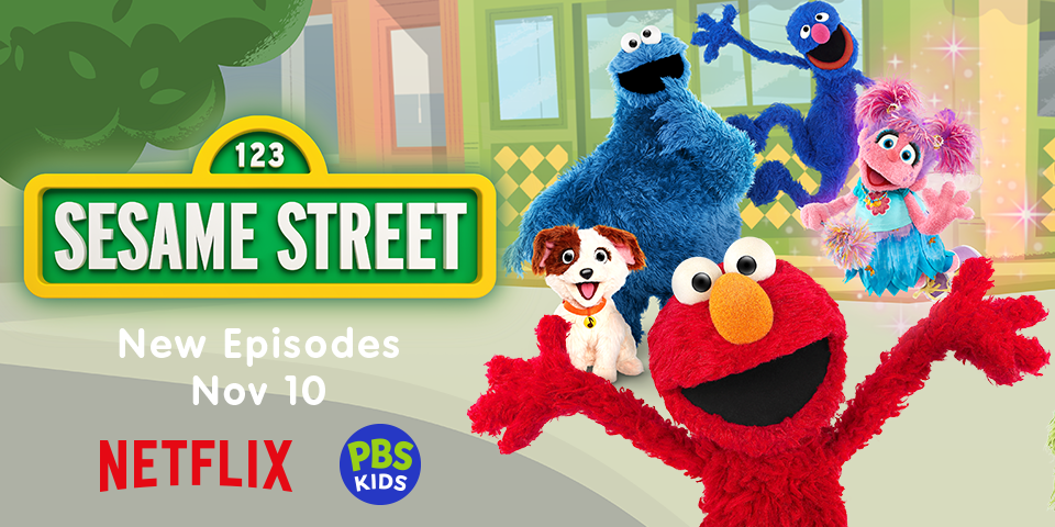 Elmo, the cookie monster, and other Sesame Street characters smile broadly as they stand next to a 123 Sesame Street sign post. The title reads, New Episodes Nov 10” above a Netflix logo and a PBS Kids logo.