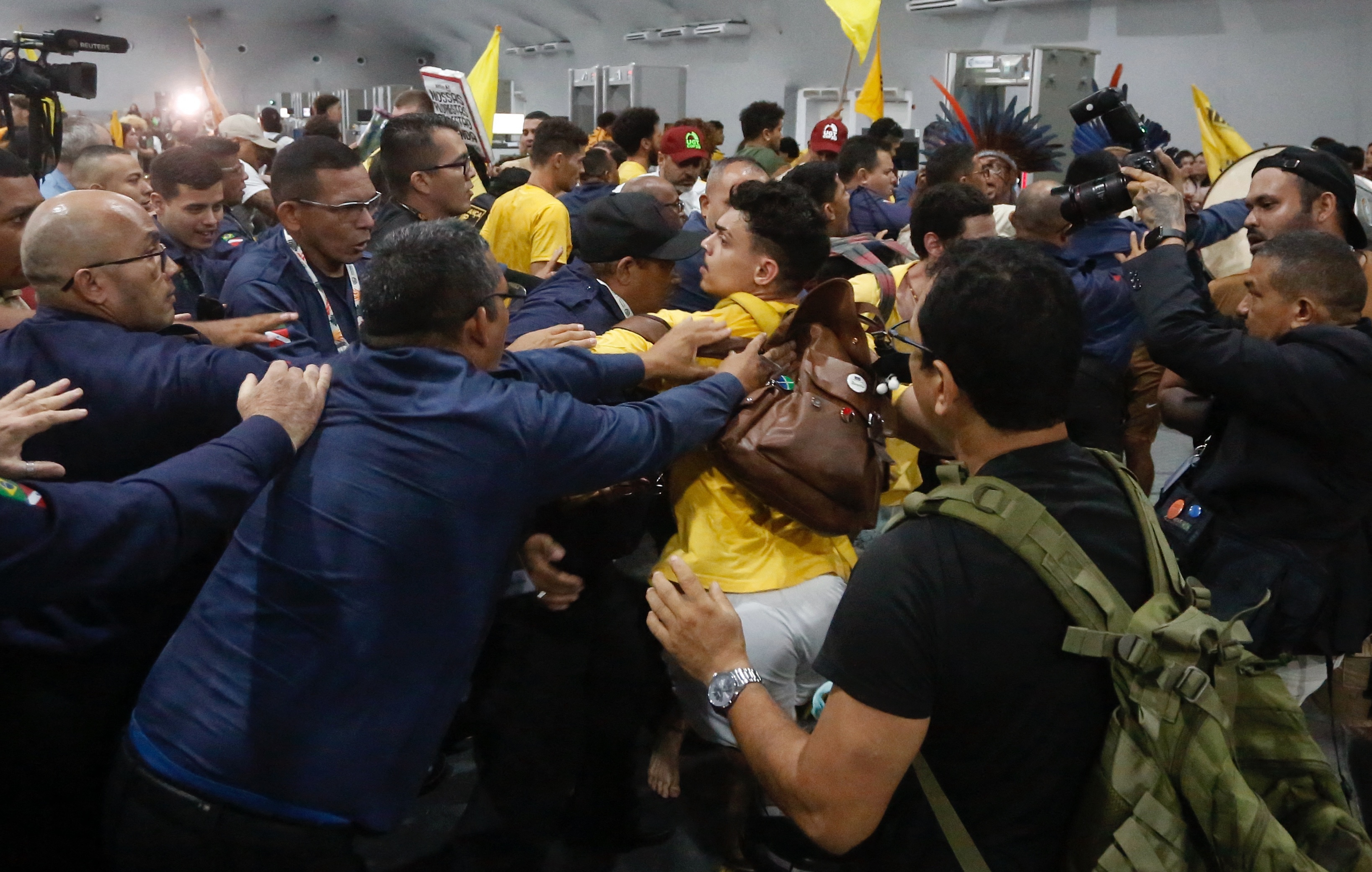 Indigenous people and protesters clash with security guards at COP30