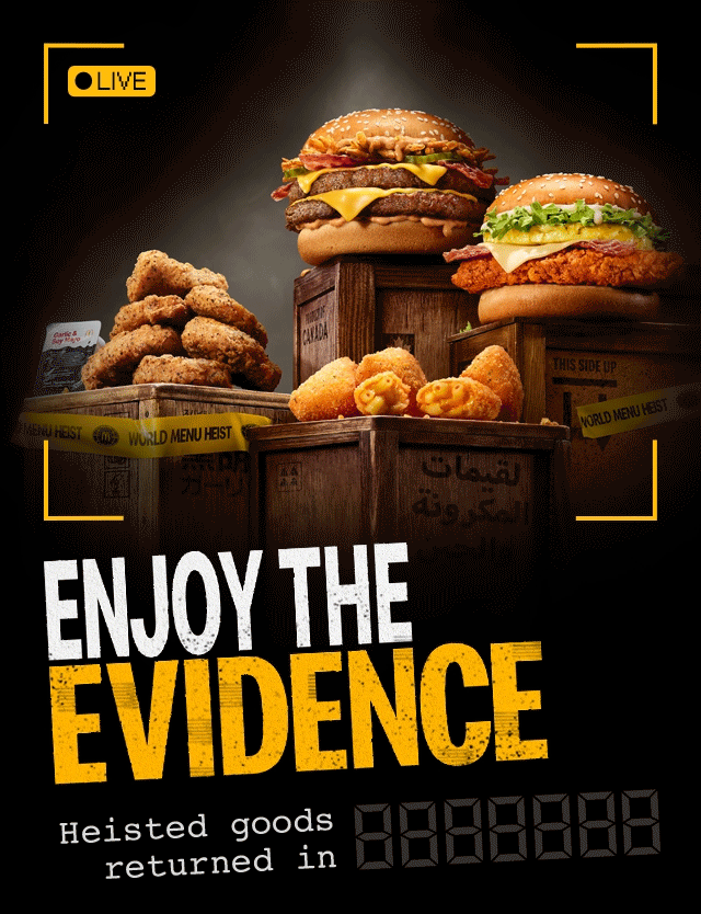 Animated GIF with the heisted menu items placed upon crates. Bold text reads 'Enjoy the evidence. Heisted goods return in 6 days'. The image then flickers and the heisted food disappears.