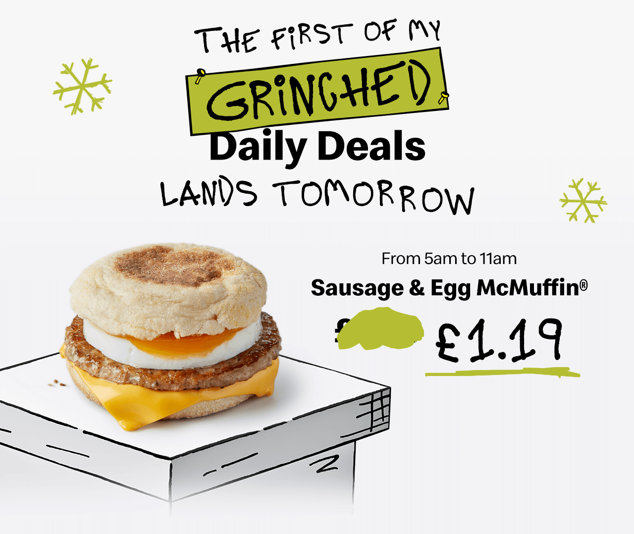 A Sausage & Egg McMuffin® on a pedestal. Bold text reads 'The first of my Grinched Daily Deals lands tomorrow. From 5am to 11am, Sausage & Egg McMuffing® £1.19'.