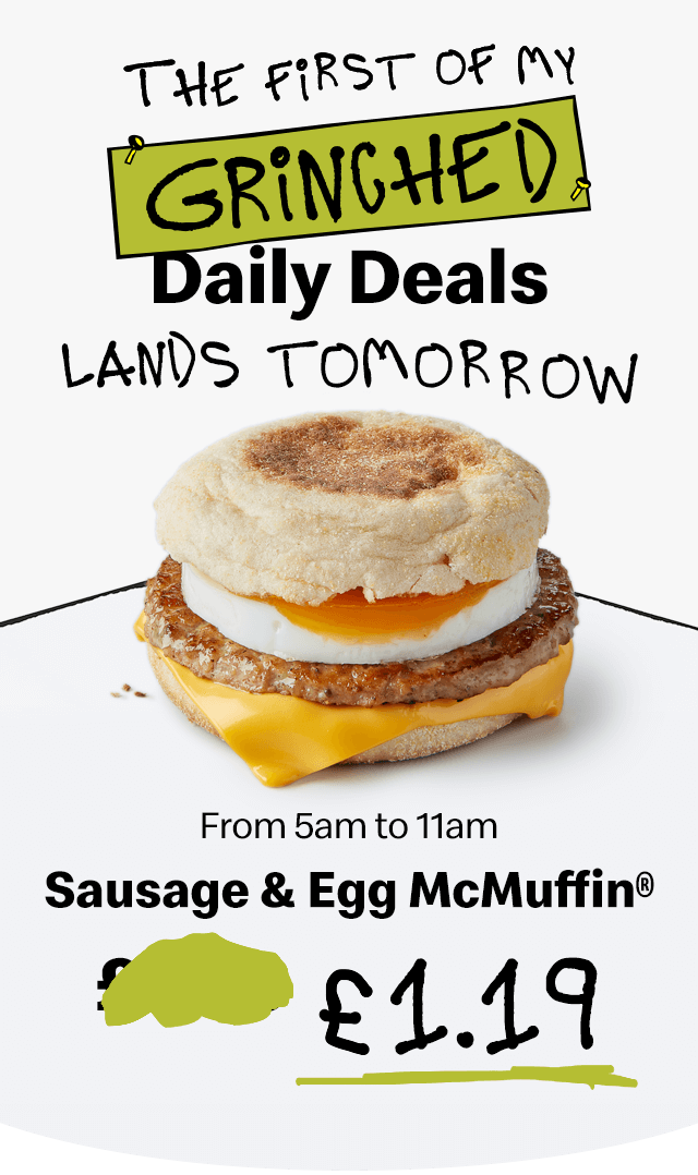 A Sausage & Egg McMuffin® on a pedestal. Bold text reads 'The first of my Grinched Daily Deals lands tomorrow. From 5am to 11am, Sausage & Egg McMuffing® £1.19'.