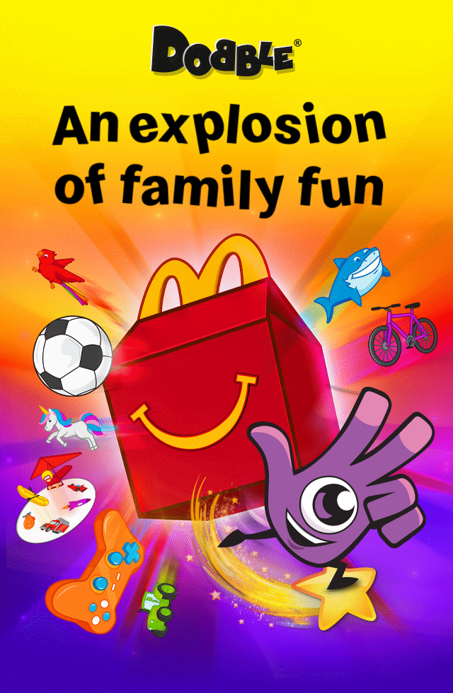 Cartoon like Happy Meal box with Dobble® icons flying out. Bold black text reads 'Dobble® an explosion of family fun'