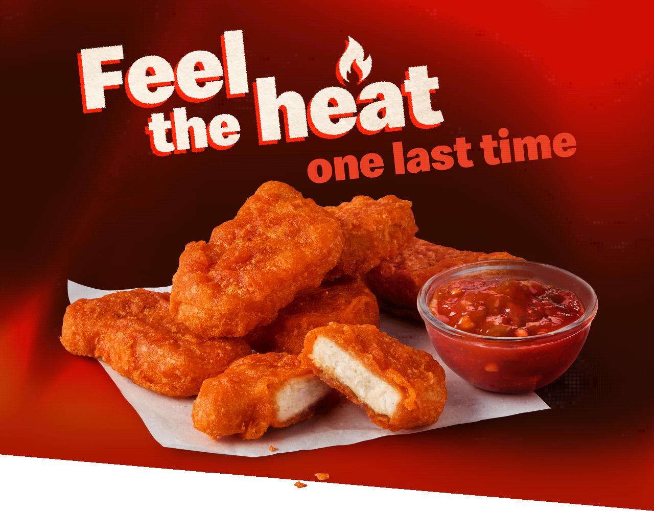 A photo of 6 Spicy McNuggets&reg;. Text on the image reads 'Feel the heat one last time'.