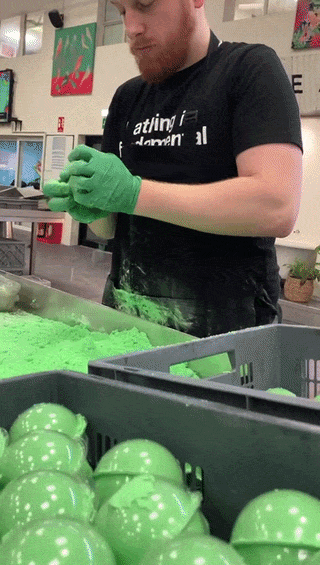 Play button - YouTube short: Day In The Life of A Bath Bomb Maker at LUSH!
