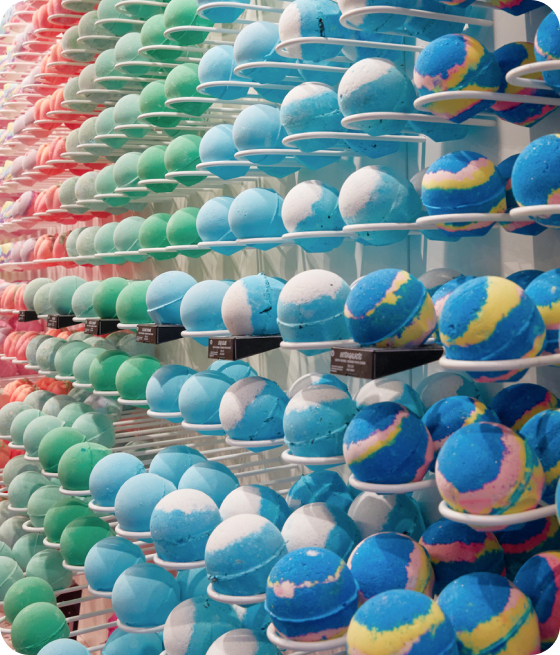 Retail shelve full of round pressed, packaging free bath bombs 