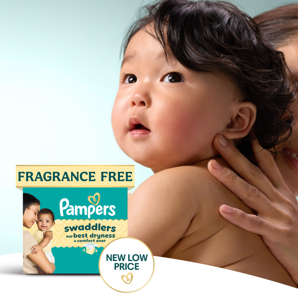 Close-up image of a baby’s face as it looks onward with an inquisitive expression. In front of this image, there’s a pack of Pampers Swaddlers and a badge that reads, “NOW FRAGRANCE FREE”.