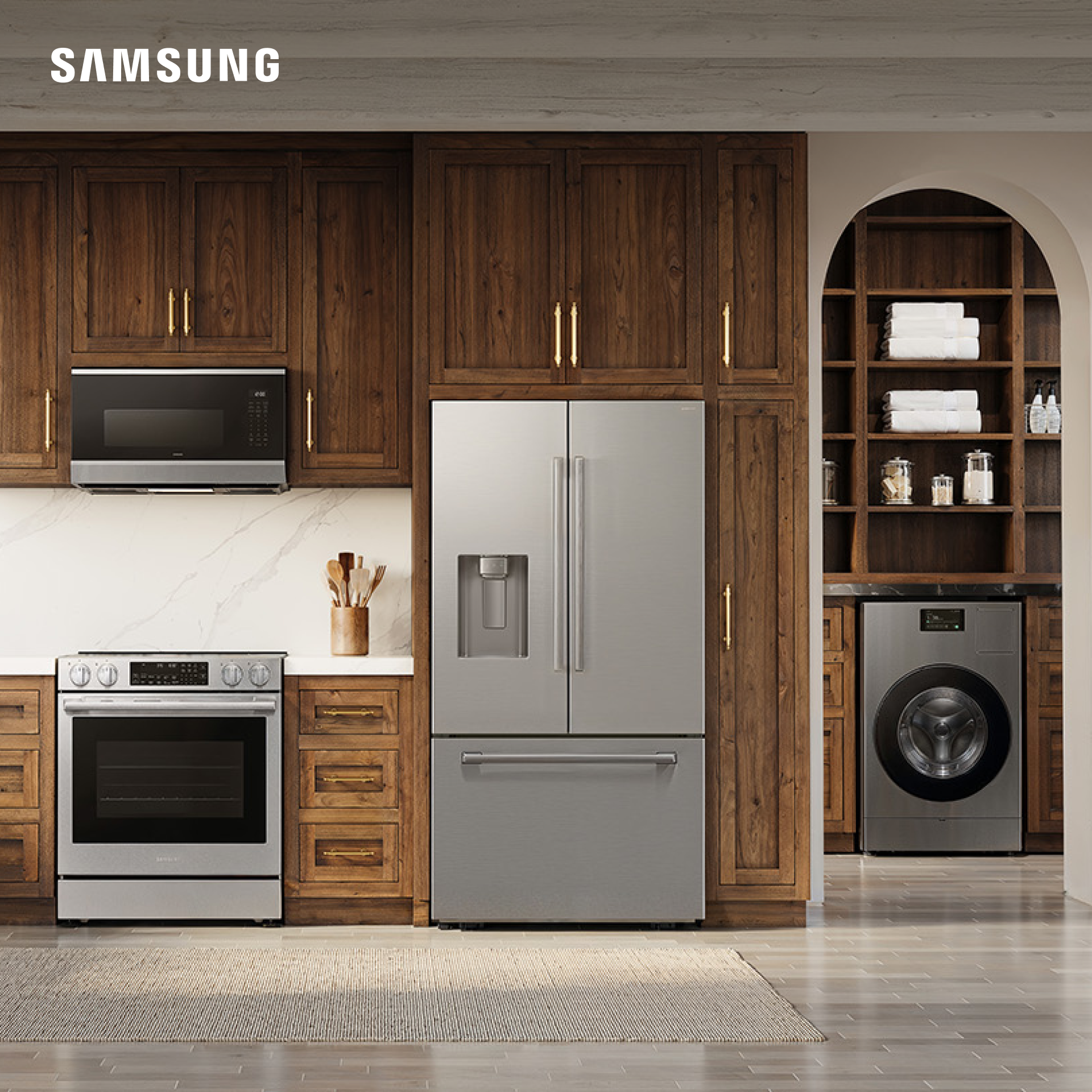 Image of a chic kitchen filled with Samsung home appliances, including a microwave, an oven, a refrigerator, and a washing machine. At the bottom left corner, there’s a Samsung logo.