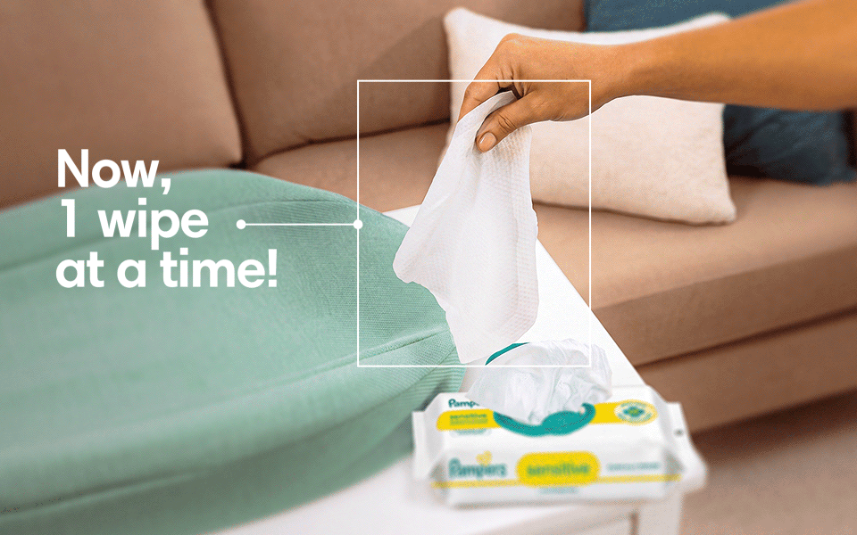 There’s a close-up visual of a hand taking a wipe out of the pack. A title animates to appear, which reads, “Now, 1 wipe at a time!”