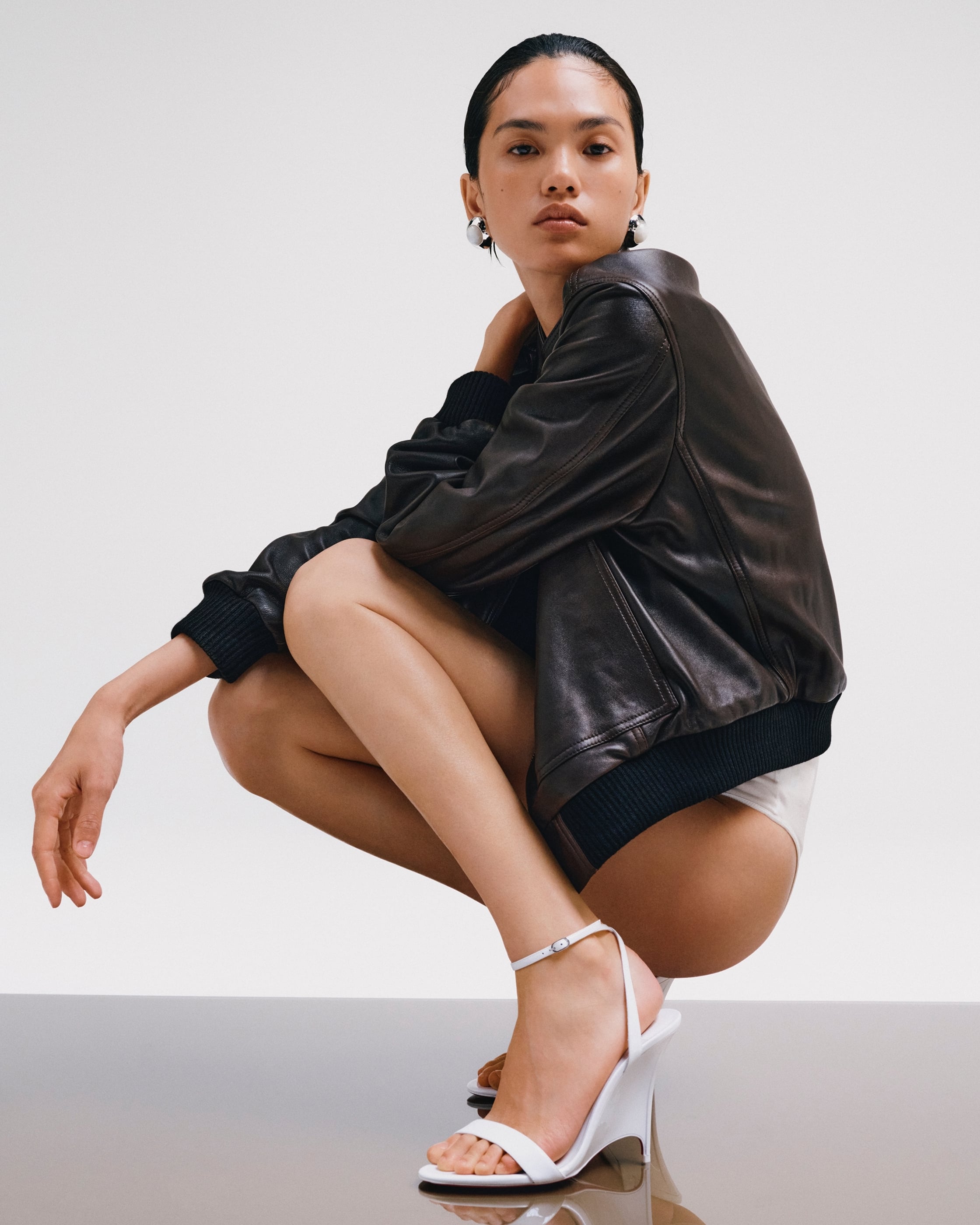 QUN YE wears CHRISTIAN LOUBOUTIN