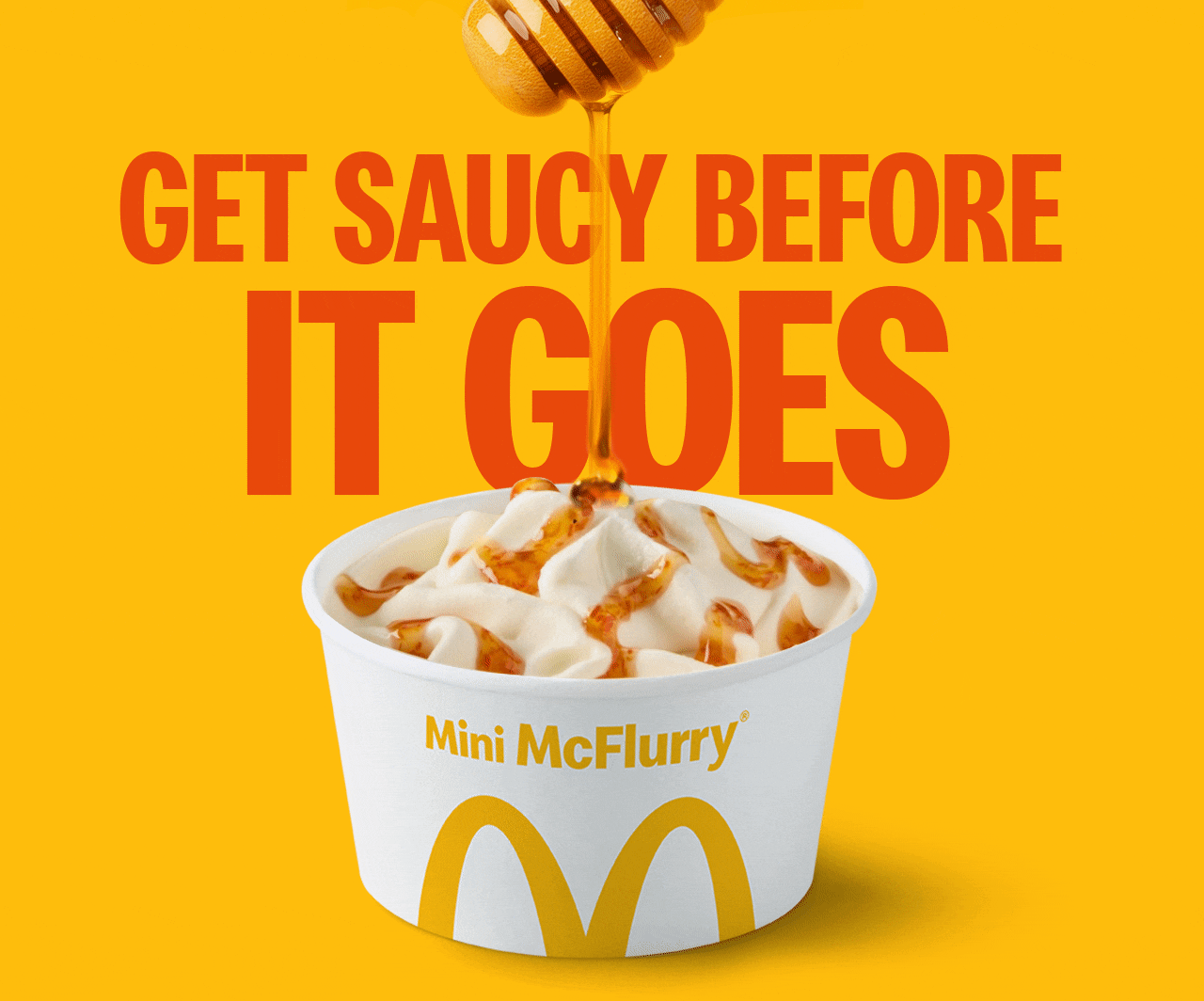 A Hot Honey McFlurry with honey drizzling down onto it from a honey dipper. Text reads 'Get saucy before it goes'.