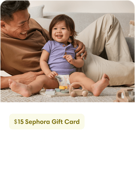 a father and daughter laugh with each other.