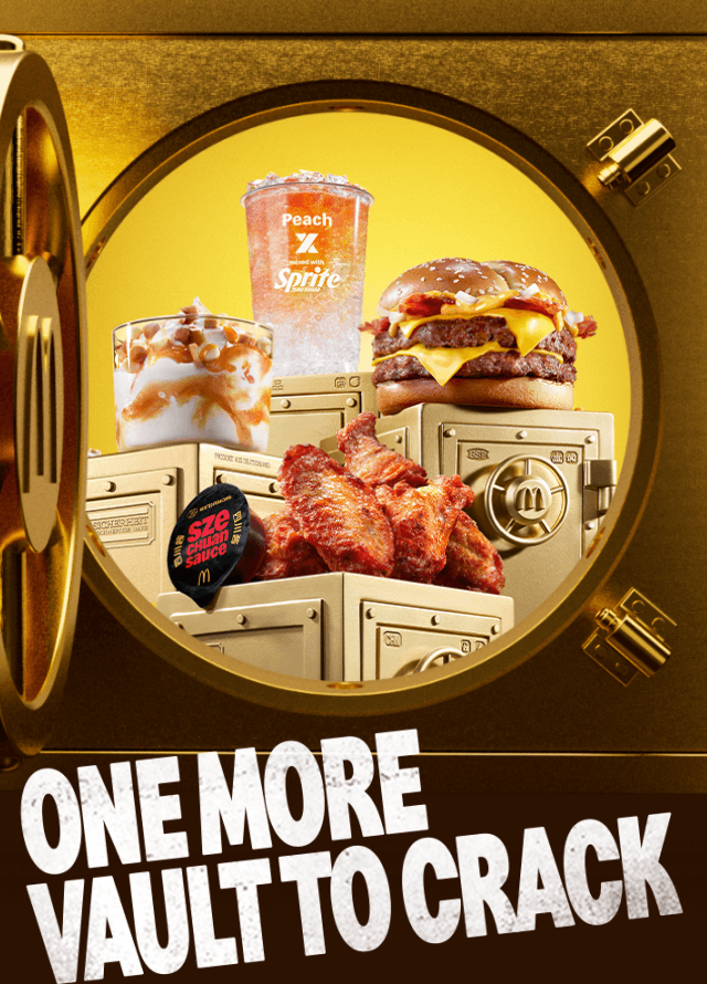 A gold vault opens to reveal new heisted food and drink items. Text in the image reads 'One more vault to crack'.