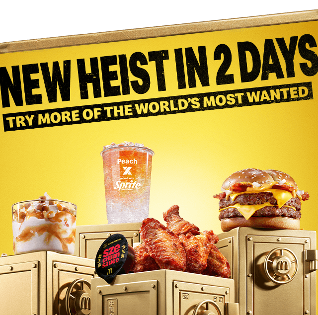 World Menu Heist food and drink on top of gold vaults. Text in the image reads 'New heist in 2 days - try more of the world's most wanted'.