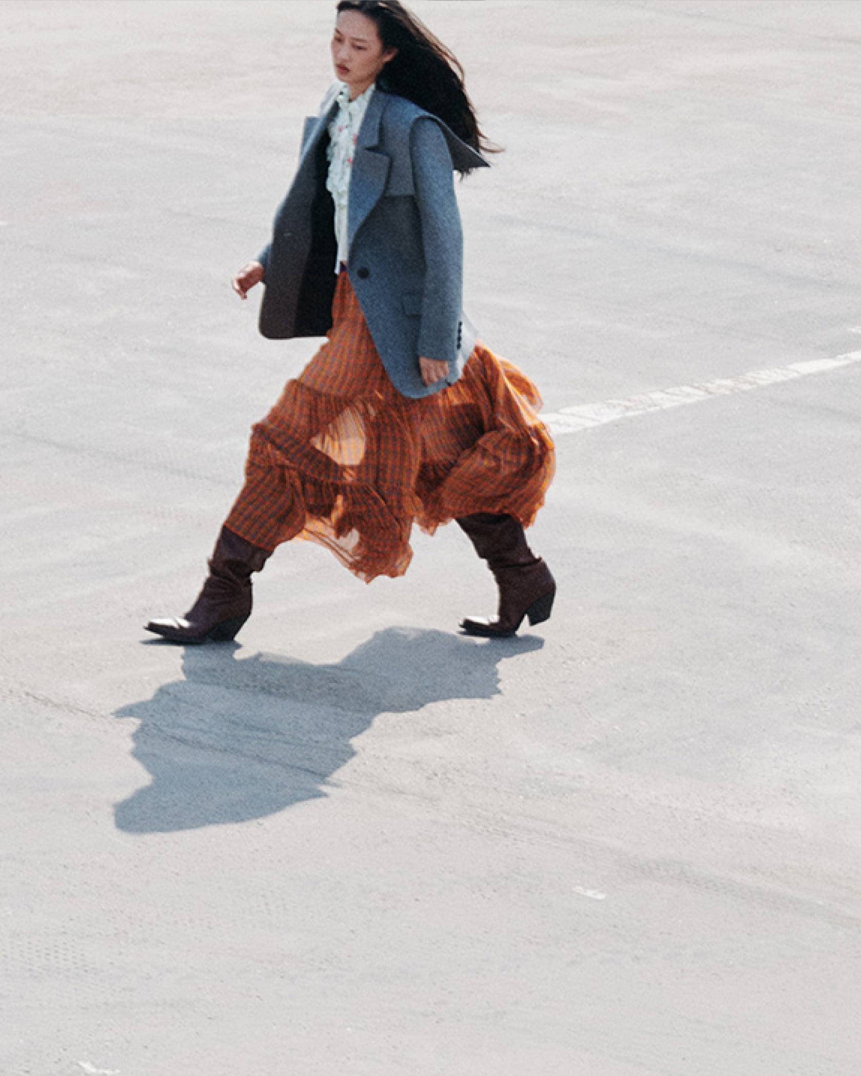 Plaid dominated the runway – the house’s signature ruffles are a feminine and chic way to wear it this season
